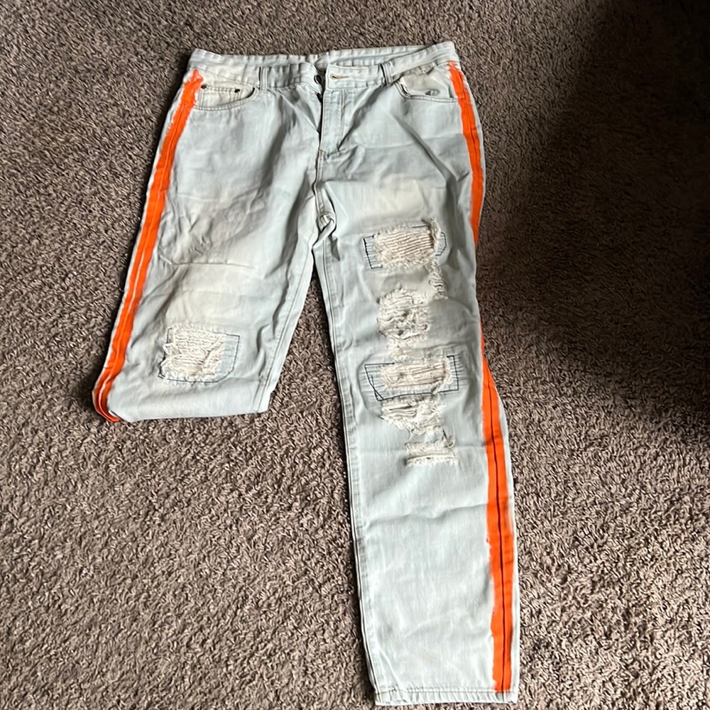 Blue jeans w/orange graffiti